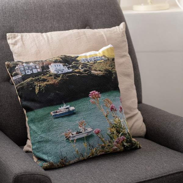 Customised photo pillow with holiday photos on chair