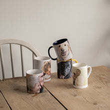 Load image into Gallery viewer, A selection of personalised photo mugs with family photos on the table
