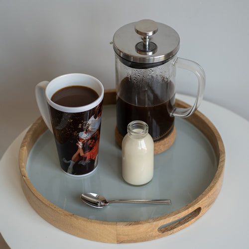 A tray with personalised latte Mug and coffee on